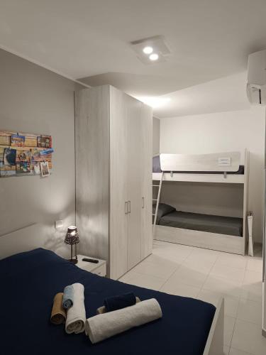 a bedroom with a bed with towels on it at Lilli & Evoque Apartments in Civitanova Marche