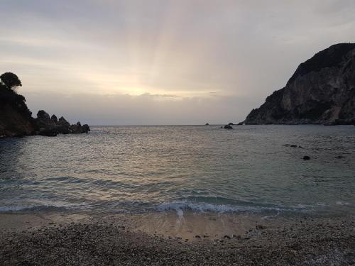 a view of the ocean from the shore of a beach at Holiday Home Matthäus am Corfutrail, Ferienoase im Olivenhain 3 km zum Meer in Giannádes