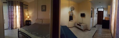 two pictures of a bedroom with a bed and a hallway at Alegre Building Lipa in Lipa