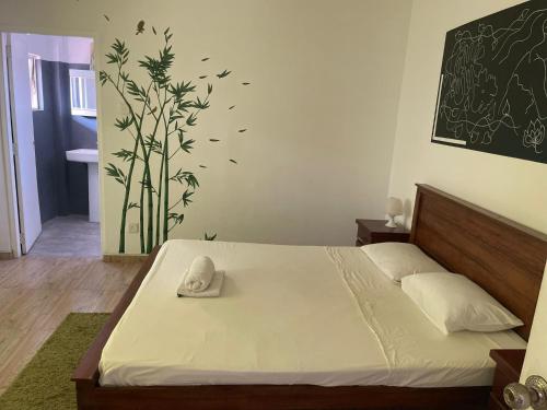 a bedroom with a bed with a towel on it at Angels Negombo in Negombo