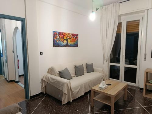 a living room with a couch and a table at Via Roma 48 in Arquata Scrivia