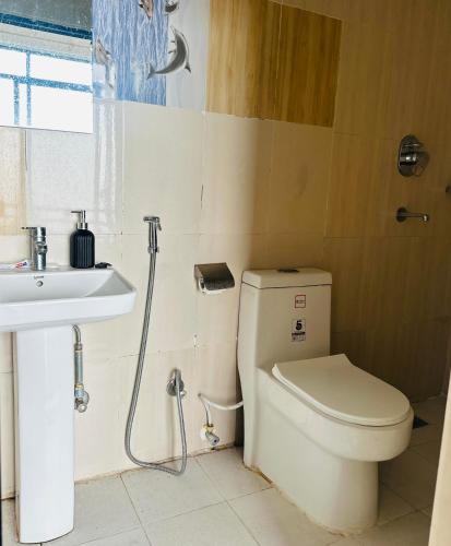 a bathroom with a toilet and a sink at The Himalayan Ridge in Kathmandu
