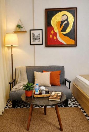 a living room with a couch and a coffee table at Old Quarter Lake House in Hanoi