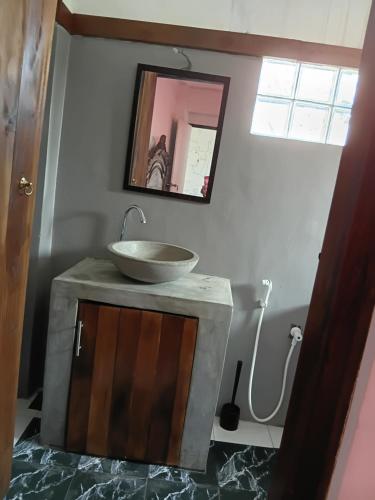 a bathroom with a sink on top of a counter at Angels Negombo in Negombo