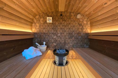 an inside of a sauna with a trash can at Wellness Villa voor 6 personen incl Sauna & Hottub in Meerssen