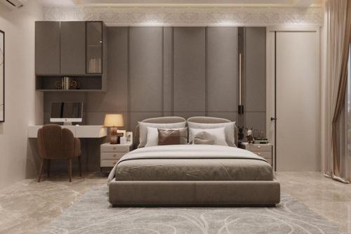 a bedroom with a large bed and a desk at Jugnu hotel in Rohtak