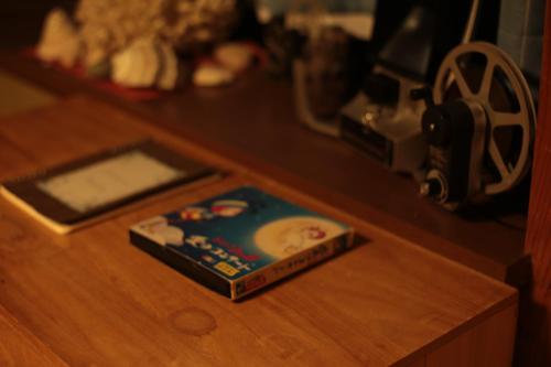 a book sitting on top of a wooden table at Holiday Cottage BANSHIRO in Setouchi