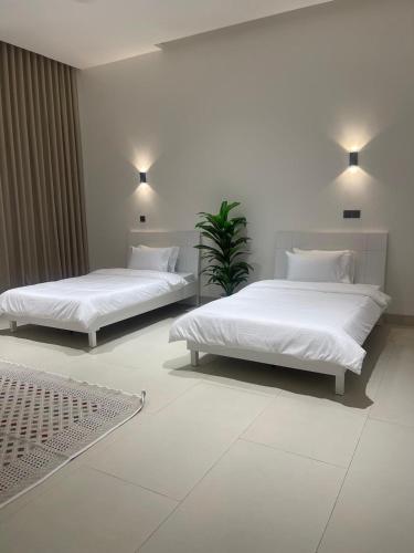 Llit o llits en una habitació de أستراحة بانا
