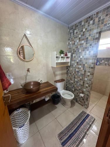 a bathroom with a sink and a toilet at Rancho Corumba VI in Alexânia