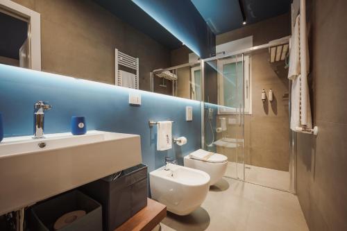 a bathroom with a sink and a toilet at Casa Costa Sud in Bari