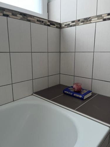 a locker room with a book on the floor at Ferienwohnung Fatlume No 3 in Bad Honnef am Rhein