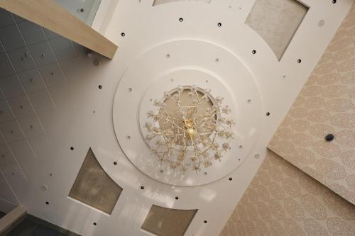 an overhead view of a ceiling with a chandelier at Hotel Amar Singh Palace in Agra