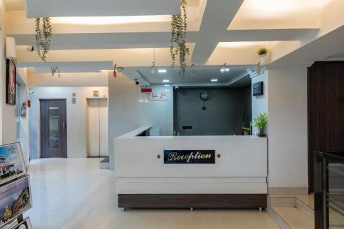 a lobby of a hair salon with a reception desk at Hotel JK Regency, Mumbai International in Mumbai