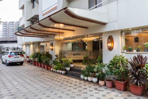 a building with plants on the side of it at Hotel JK Regency, Mumbai International in Mumbai