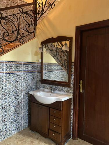 a bathroom with a sink and a mirror at Maison in Berkane