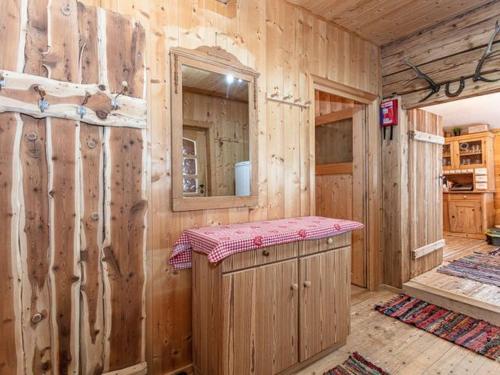 a wooden cabin with a counter and a mirror at Almhütte Bairau Kaser in Lofer