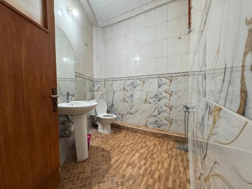 a bathroom with a sink and a toilet at Dar Bennis 2 in Rabat