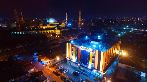 a view of a city at night with lights at Amaris Hotel Pekanbaru in Pekanbaru