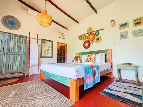 a bedroom with a bed in a room at Garnet Yala Beach in Kirinda