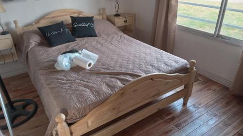 a bed with a roll of toilet paper on it at Santa Relax in Frente Mar