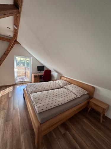 a bedroom with a bed in a room at PS5, VR2, Logitech racing-Apartmán pod Chočom in Leštiny
