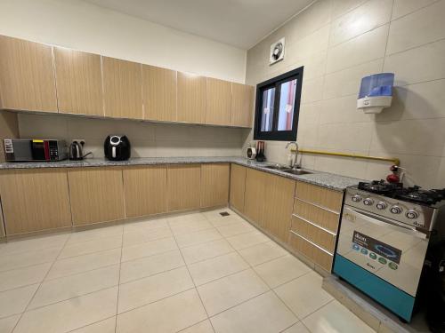 Køkken eller tekøkken på Sohar Square Apartment