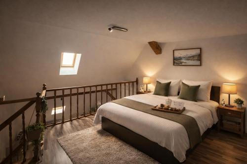 a bedroom with a large bed with a tray on it at OLD TOWN Palatul Agoston Galgon in Timişoara