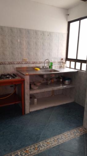a kitchen with a sink and a counter top at Apartamento Macanal in Macanal
