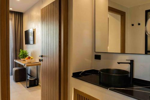 a kitchen with a sink and a counter top at Anesea City in Heraklion