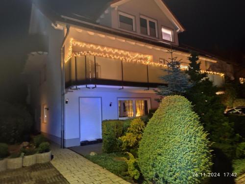 a house lit up at night with lights on it at Haus Nuhn in Bad Wildungen