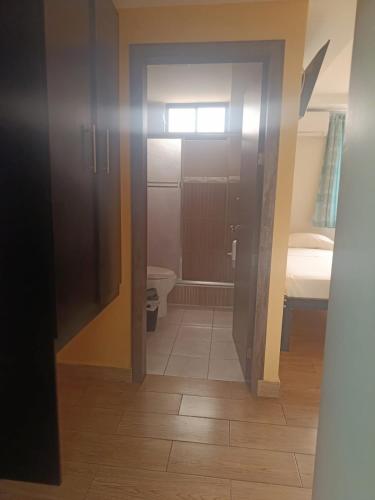 an open door to a bathroom with a toilet at Hotel Stella blu in Manta