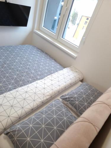 a room with two beds and a window at Jahorina Lux in Jahorina