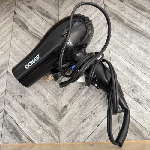 a hair dryer sitting on top of a wooden floor at Excellent Place to Stay in Coquitlam