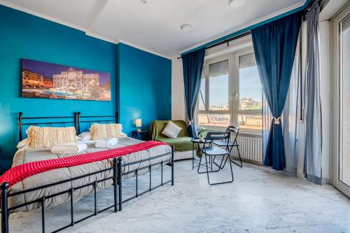 a bedroom with a bed and a blue wall at Domus Antica Trastevere in Rome