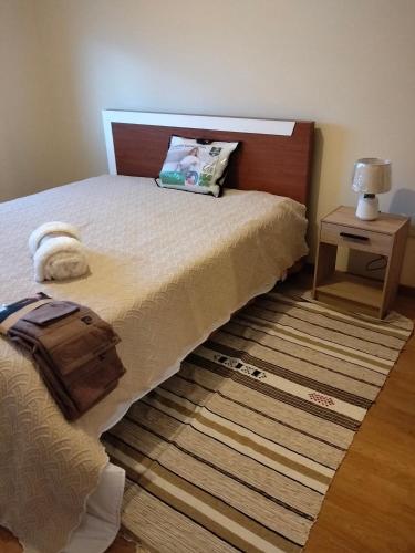 a bedroom with a bed with a suitcase on it at apartment with 5 bedrooms in Bragança
