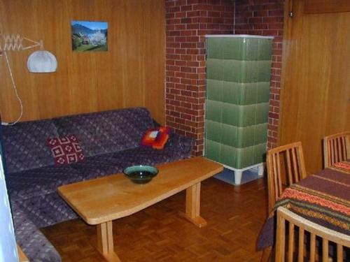 a living room with a couch and a table at Apartment Gubel by Interhome in Alt Sankt Johann