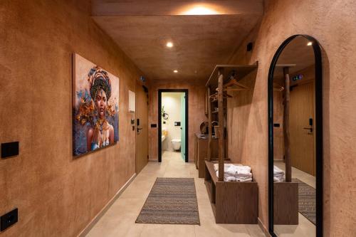 a hallway with a large painting on the wall at Salud Ierissos in Ierissos