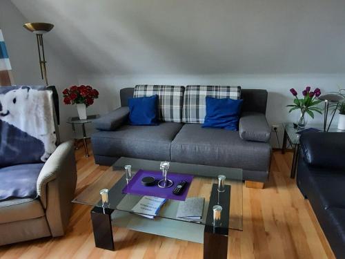 a living room with a couch and a table at Apartment Gill by Interhome in Stelle