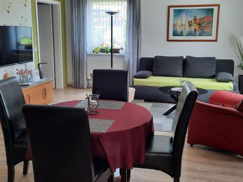 a living room with a table and a couch at Apartment Gill by Interhome in Stelle