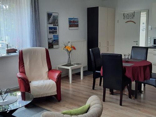 a living room with a table and chairs at Apartment Gill by Interhome in Stelle