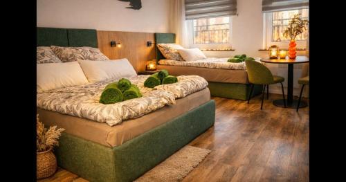 a bedroom with a bed and a couch and a table at Studio-Apartament 101 free Parking Domus Kushal in Viersen