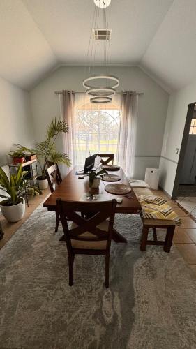 a living room with a wooden table and a couch at Andrei's nest in Oklahoma City