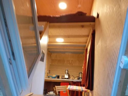 a view of a kitchen from a tiny house at Holiday Home Tiny Hause by Interhome in St. Gallen