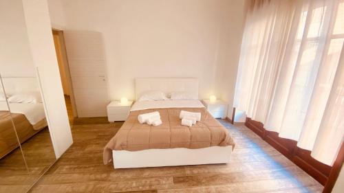 a bedroom with a bed with two towels on it at Art home Amalfi coast in Salerno