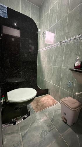 a bathroom with a sink and a toilet in it at Suites da Bela 02 Caparaó in Caparaó Velho