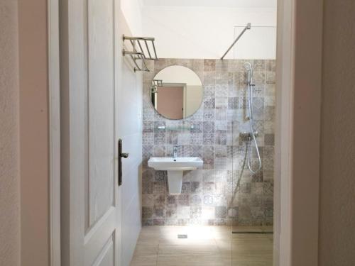 a bathroom with a sink and a mirror at Casa Giulia in Vama Veche