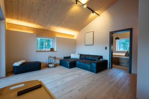 a living room with a couch and a table at Bomwäldele 89 in Bichlbach