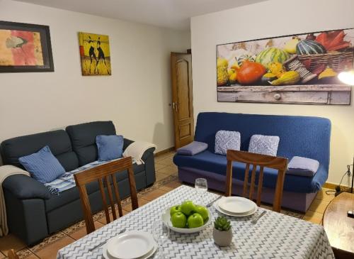 a living room with a couch and a table at Villa Luisa Apartment in Somo