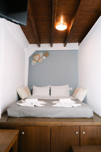 a bedroom with a bed with towels on it at Rhodes Central Apartment in Rhodes Town