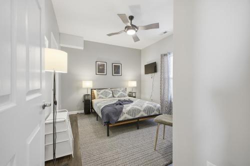 a bedroom with a bed and a ceiling fan at Sun Valley Courtyard, No Steps in Saint Joseph